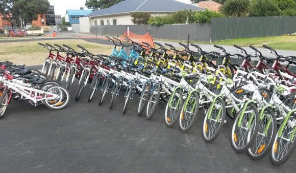 Tidy rows of bikes lined up on a school field